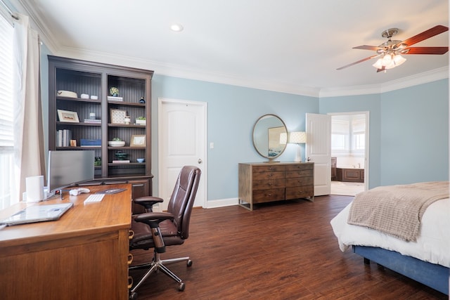 bedroom with baseboards, ensuite bathroom, dark wood finished floors, and crown molding