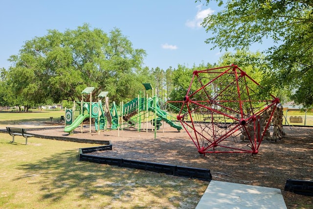 community play area featuring a lawn