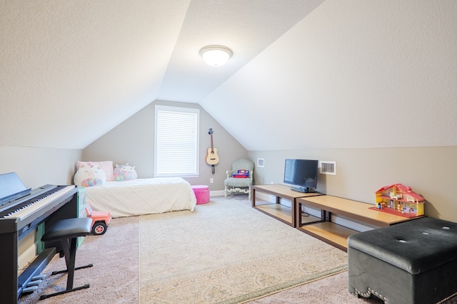 carpeted bedroom with visible vents, vaulted ceiling, a textured ceiling, and baseboards