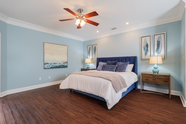 bedroom with crown molding, wood finished floors, visible vents, and baseboards