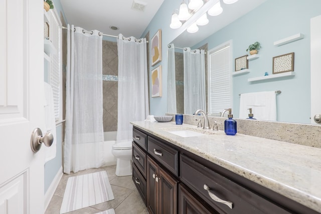 full bathroom with tile patterned flooring, toilet, vanity, visible vents, and shower / bath combo