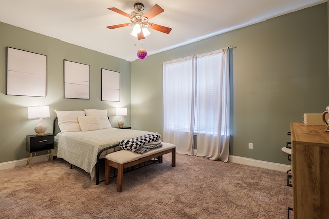 bedroom featuring a ceiling fan, carpet, and baseboards