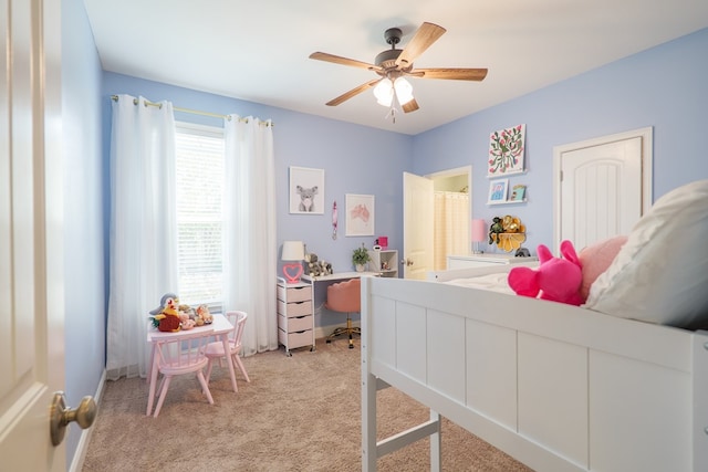 bedroom featuring a ceiling fan and light carpet