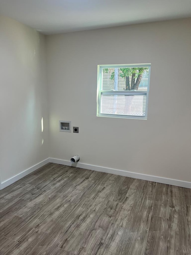 119 E Merrill St, Thomasville, GA 31792 - washroom featuring hookup for an electric dryer, baseboards, hookup for a washing machine, wood finished floors, and laundry area