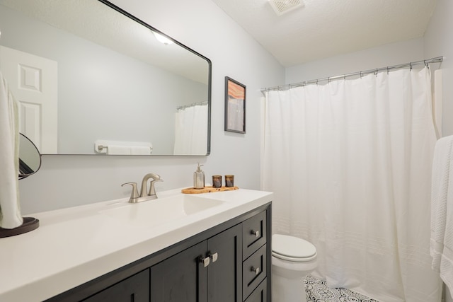bathroom featuring visible vents, toilet, tile patterned flooring, and vanity