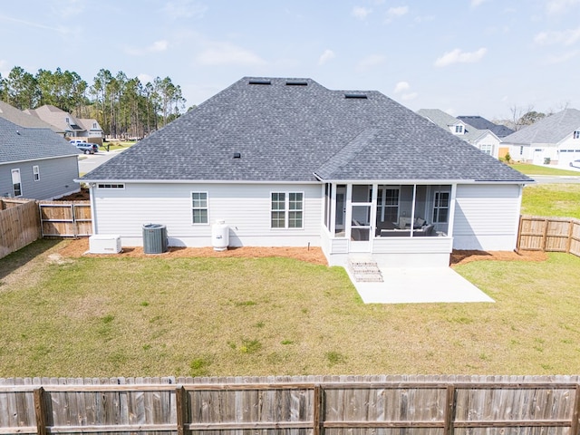 3041 Houser Way, Hahira, GA 31632 - rear view of property featuring a fenced backyard, a sunroom, central AC, a shingled roof, and a lawn