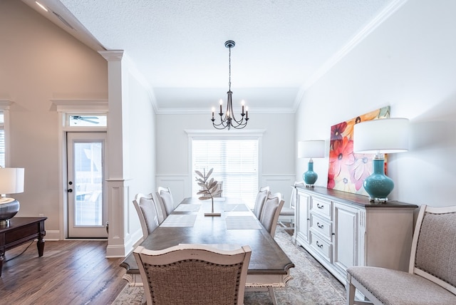 3041 Houser Way, Hahira, GA 31632 - dining space with wainscoting, a chandelier, dark wood-style flooring, and ornamental molding