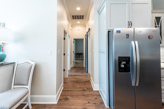 3041 Houser Way, Hahira, GA 31632 - hallway with visible vents, ornamental molding, wood finished floors, recessed lighting, and baseboards