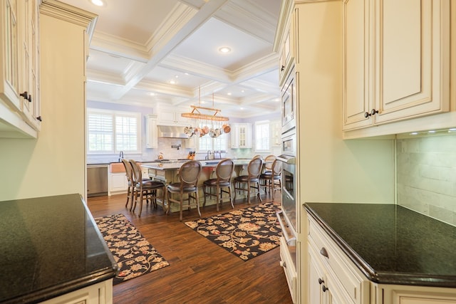 4333 Spring Branch Cir, Valdosta, GA 31601 - dining room featuring plenty of natural light, dark wood-style floors, beam ceiling, crown molding, and coffered ceiling