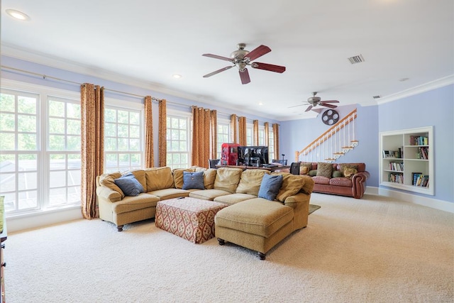 living area with ornamental molding, carpet floors, and visible vents