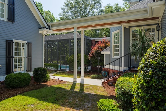 view of yard featuring glass enclosure