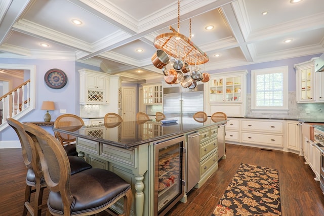 4333 Spring Branch Cir, Valdosta, GA 31601 - kitchen with wine cooler, built in refrigerator, coffered ceiling, a breakfast bar area, and a center island