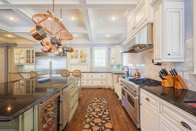 4333 Spring Branch Cir, Valdosta, GA 31601 - kitchen with high quality appliances, a chandelier, coffered ceiling, wine cooler, and dark wood-style flooring