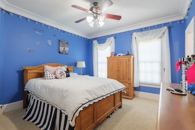 bedroom with crown molding, ceiling fan, light colored carpet, and baseboards
