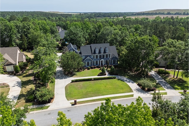 drone / aerial view with a view of trees