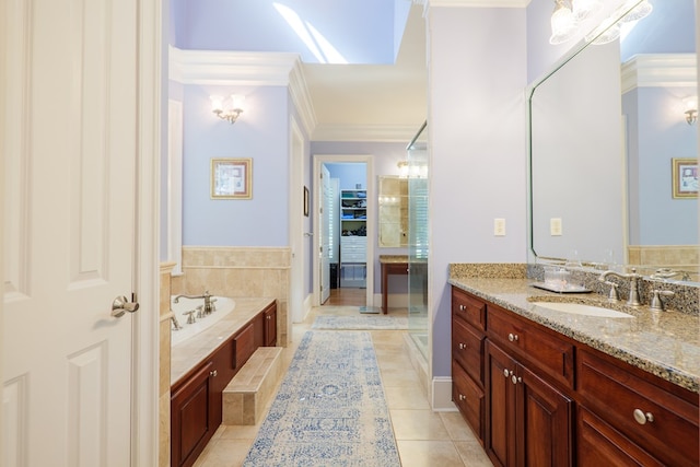 full bath with vanity, ornamental molding, a garden tub, and tile patterned floors