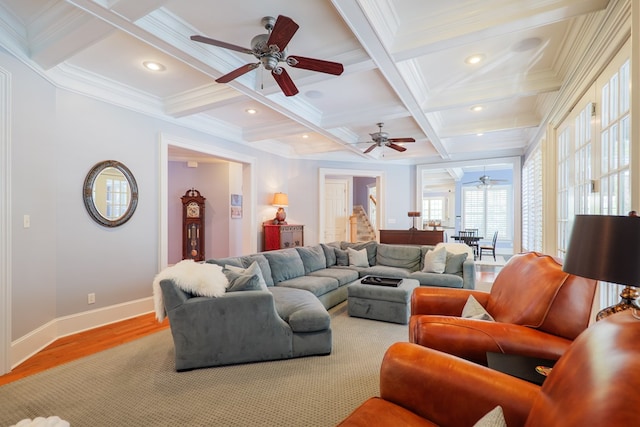 living room with light wood-style flooring, coffered ceiling, baseboards, ceiling fan, and beamed ceiling