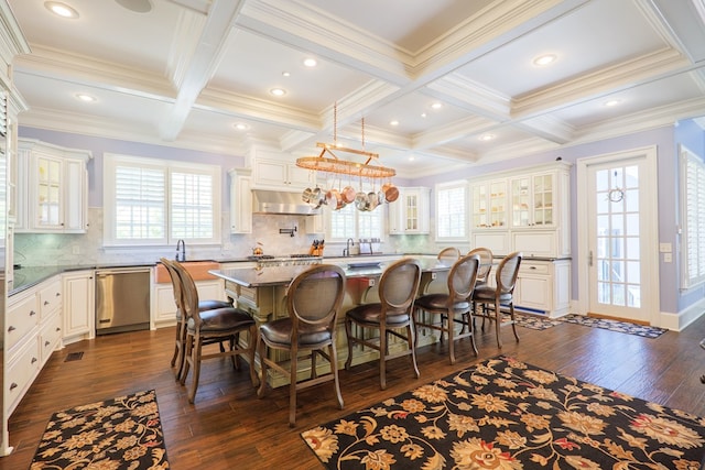 interior space with coffered ceiling, dark wood-style floors, and plenty of natural light