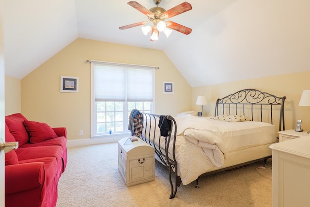 bedroom with light carpet, baseboards, lofted ceiling, and ceiling fan