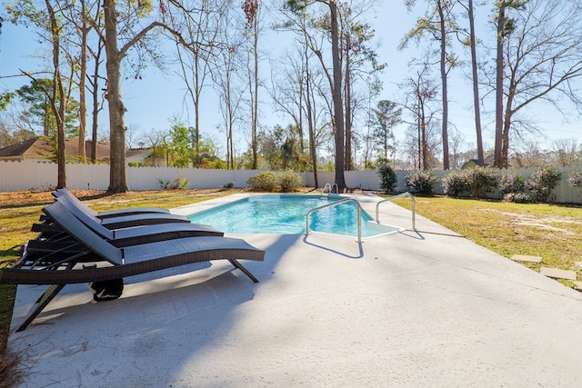 view of swimming pool with a yard, a patio area, a fenced backyard, and a fenced in pool