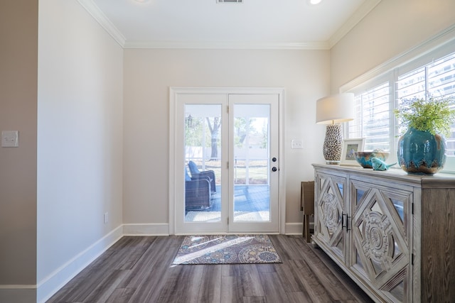 doorway with baseboards, visible vents, ornamental molding, and dark wood-style flooring