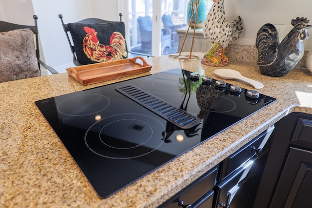 interior details featuring black electric cooktop