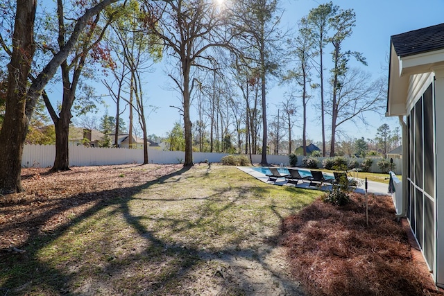 view of yard with a patio area, a fenced backyard, and a fenced in pool