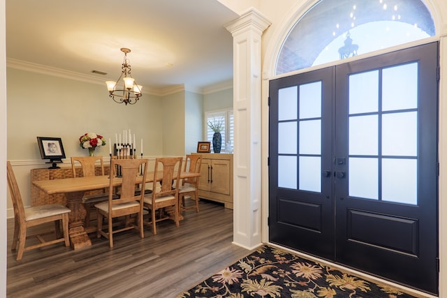 entryway with an inviting chandelier, visible vents, ornamental molding, and french doors