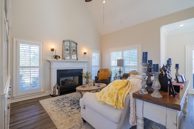 living room with high vaulted ceiling, dark wood-style flooring, a fireplace with flush hearth, and recessed lighting