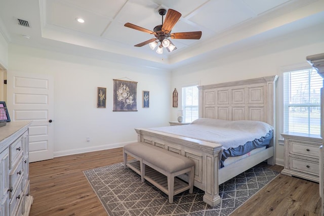 bedroom with multiple windows, ceiling fan, and dark hardwood / wood-style floors