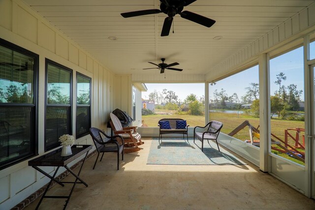 sunroom / solarium with plenty of natural light and ceiling fan