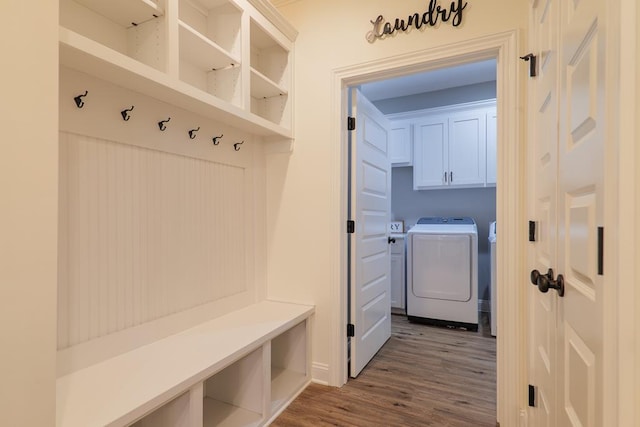 mudroom with washer and dryer and hardwood / wood-style flooring