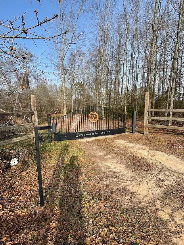 view of gate featuring fence