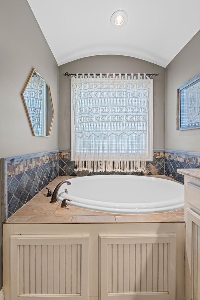 4186 Bowen Way, Valdosta, GA 31605 - full bath featuring healthy amount of natural light, radiator heating unit, a bath, and vaulted ceiling
