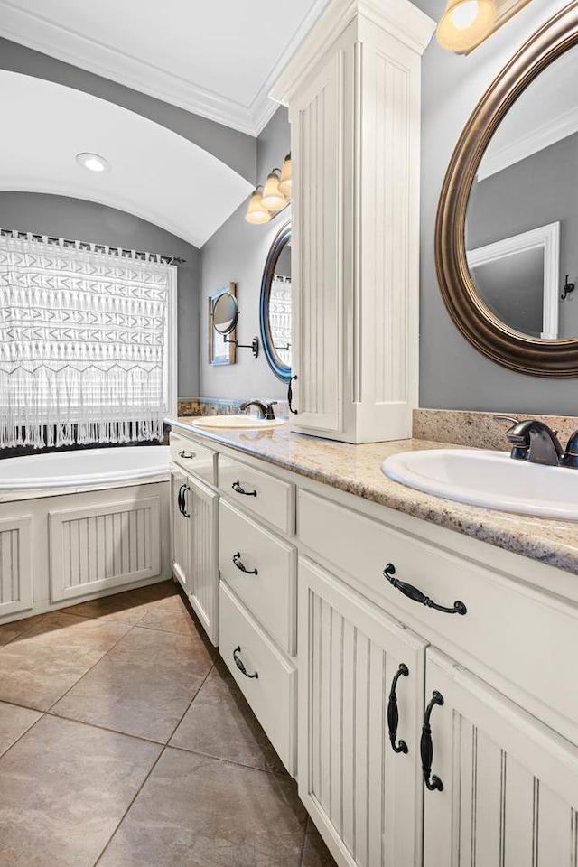 4186 Bowen Way, Valdosta, GA 31605 - bathroom with crown molding, double vanity, a garden tub, and tile patterned floors