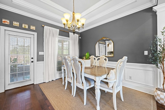 4186 Bowen Way, Valdosta, GA 31605 - dining area with a chandelier, crown molding, a wainscoted wall, wood finished floors, and a tray ceiling