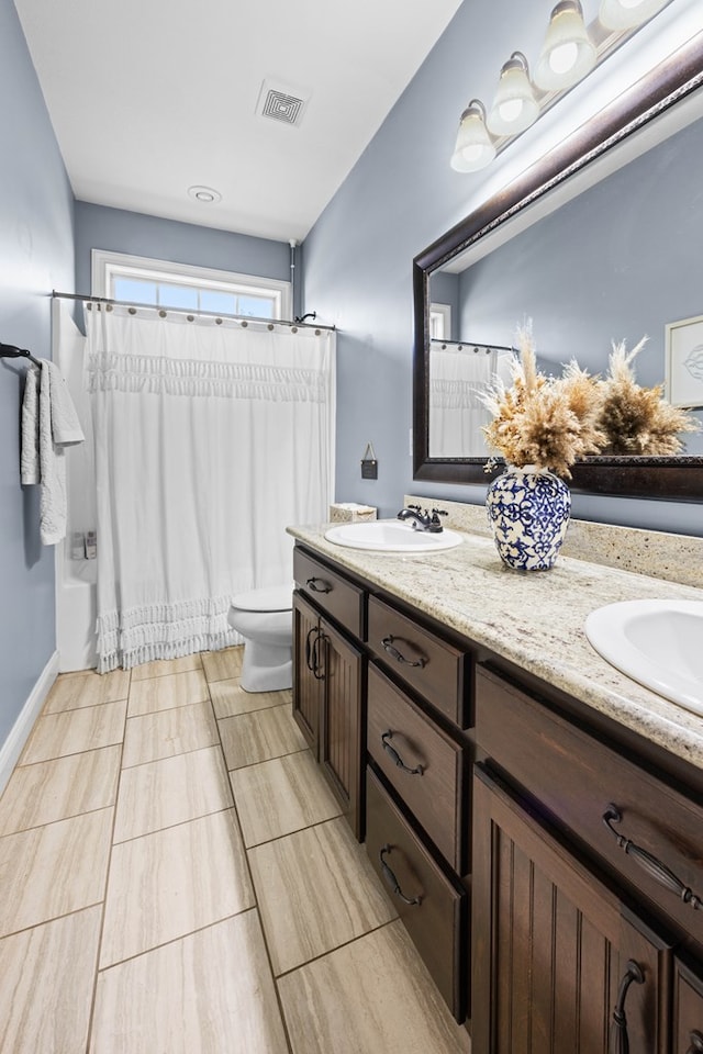 4186 Bowen Way, Valdosta, GA 31605 - bathroom with double vanity, toilet, and shower / bath combo