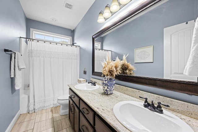 4186 Bowen Way, Valdosta, GA 31605 - full bathroom featuring double vanity, toilet, shower / bathtub combination with curtain, and baseboards
