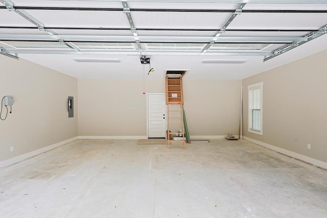2830 Loch Laurel Rd, Valdosta, GA 31601 - garage featuring electric panel, a garage door opener, and baseboards