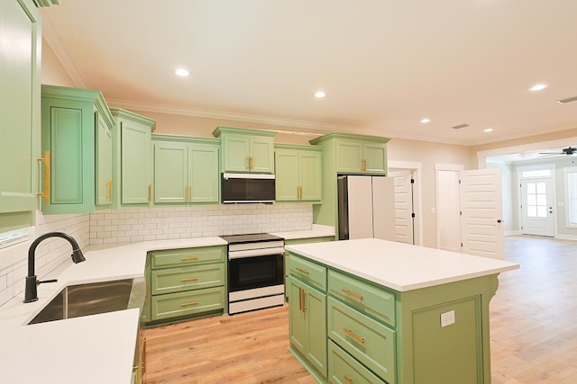 2830 Loch Laurel Rd, Valdosta, GA 31601 - kitchen featuring range with electric cooktop, green cabinets, stainless steel microwave, crown molding, and recessed lighting