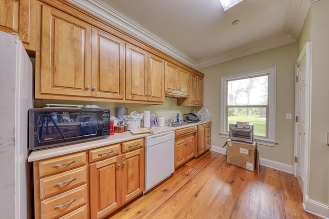 8262 Troupeville Rd, Valdosta, GA 31602 - kitchen featuring white appliances, crown molding, light wood-style floors, light countertops, and a sink