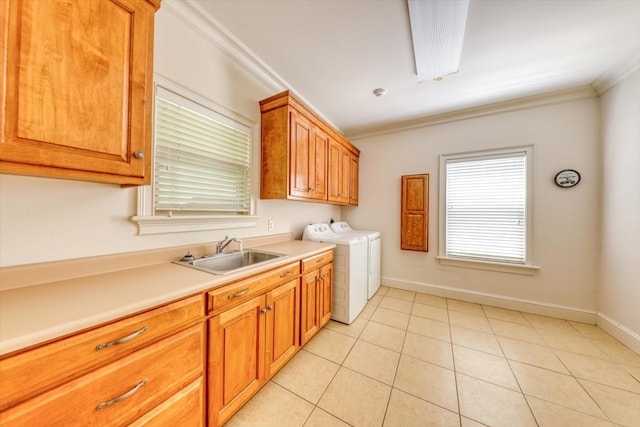 8262 Troupeville Rd, Valdosta, GA 31602 - kitchen with a sink, washer and clothes dryer, crown molding, light countertops, and light tile patterned floors