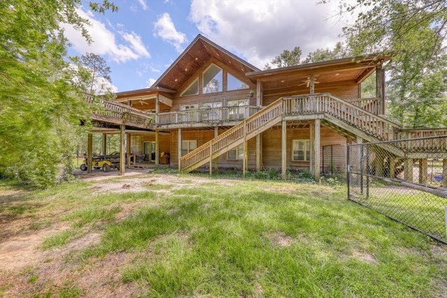 8262 Troupeville Rd, Valdosta, GA 31602 - back of property with stairs, a deck, and a ceiling fan