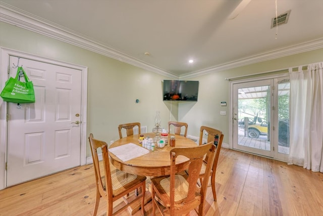 8262 Troupeville Rd, Valdosta, GA 31602 - dining room featuring crown molding, light wood finished floors, recessed lighting, and baseboards
