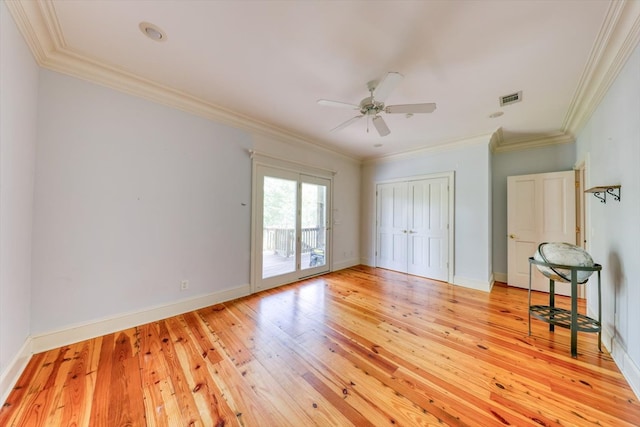 8262 Troupeville Rd, Valdosta, GA 31602 - unfurnished bedroom with access to outside, light wood-style flooring, ornamental molding, a closet, and a ceiling fan