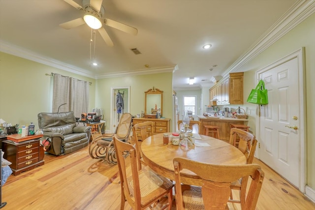 8262 Troupeville Rd, Valdosta, GA 31602 - dining room with ornamental molding, light wood-type flooring, ceiling fan, and recessed lighting