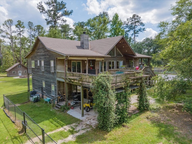 8262 Troupeville Rd, Valdosta, GA 31602 - rear view of property featuring a wooden deck, a chimney, and a patio