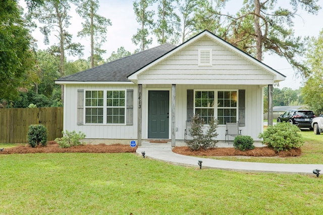 view of front of house with a front lawn and covered porch