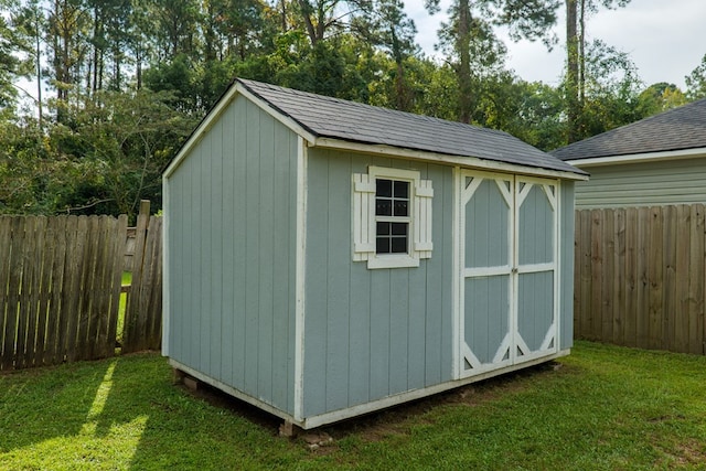 view of outdoor structure with a lawn