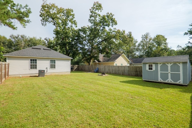 view of yard with a storage unit and central AC unit